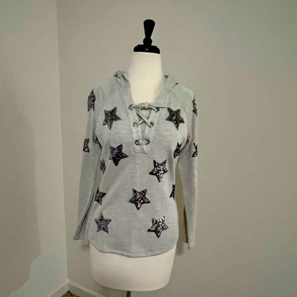 INC grey hoodie with silver sequined stars.